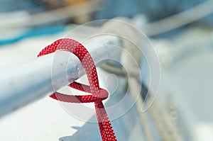 Closeup of red thin short line used for yachting purposes