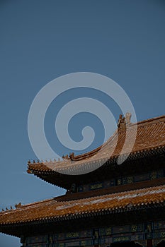 Closeup of a red-tiled facade of a building in the Forbidden City in Beijing, China