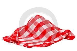 Closeup of a red and white checkered napkin or tablecloth texture isolated on white background. Kitchen accessories. Top view