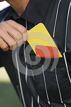 Closeup Of Referee Taking Card From Pocket