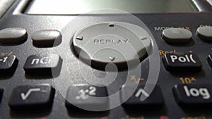 Closeup of Replay button of Casio FX-82MS Non-Programmable Scientific Calculator