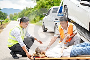 Closeup rescue helping woman driver from car accident on road