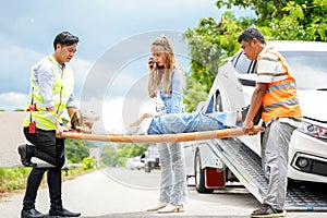 Closeup rescue helping woman driver from car accident on road