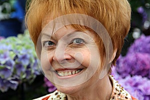 Closeup of retired woman with red hair