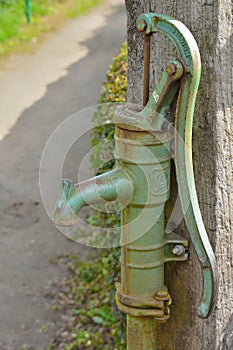 Closeup of a retro water pump in the allotments of Ghent-Bruges photo