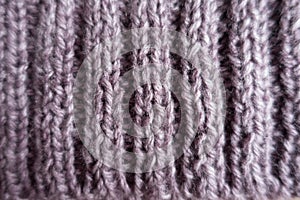 Closeup of ribs on puce knitted fabric photo