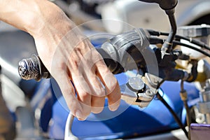 Closeup on rider's hand on the handlebar