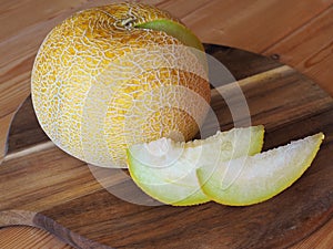 Closeup of ripe juicy melon. Two slices of yellow melon