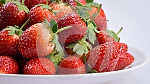 Closeup ripe strawberry on white plate