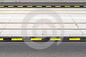 Closeup on road delineator or separator lines for cars for safety in city