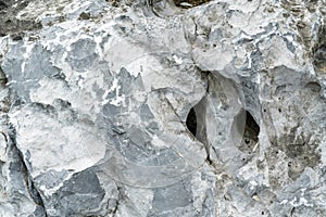 Closeup rock pattern with hole in nature