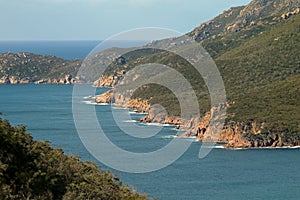 Closeup of rocky seashore of Wineglass Bay in Freycinet National