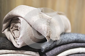 Closeup rolled beige cashmere woollen blanket