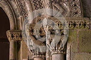 Closeup of romanesque archivolts and capitals photo