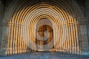 Closeup of the Romanesque semicircular arches at the portal of the Convent of Sant Salvador d\'Horta