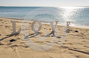 Romantic love sign on a tropical beach paradise