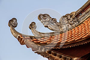 Closeup of rooftop tiles and ornamentation at the Temple of Literature, Hanoi, Vietnam