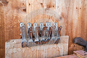 Closeup of a row of iron clips in a tool shed
