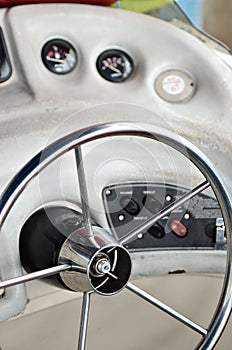 Closeup of rudder and chair in a luxury boat in black and white