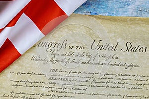 Closeup of ruffled American flag on the preamble to the Constitution of the United States of America