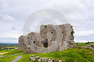 Closeup of a ruins of castle under the stormy sky