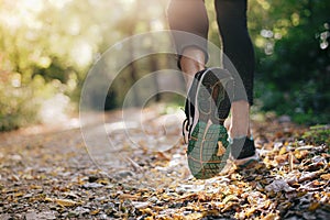 Closeup of running shoe of the person running in the nature