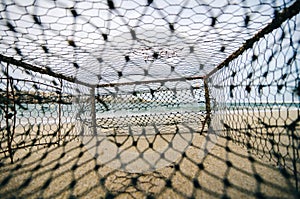 closeup rusty crab pot on the sandy beach