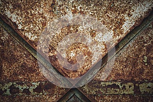 Closeup of a rusty old metallic door - a cool picture for wallpapers and background