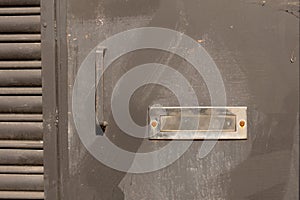 Closeup rusty steel door with mail slot photo