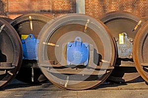 Closeup of rusty train wheels, side view