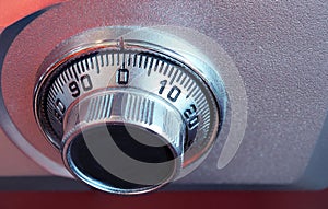 closeup of a safe and the combination dialer.