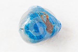 Polished Shattuckite rock on white marble