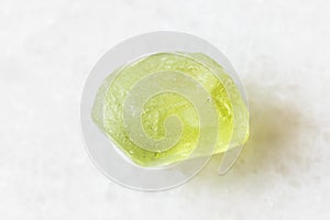 Raw Olivine Peridot, Chrysolite crystal on white photo