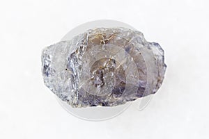 Unpolished Cordierite Iolite crystal on white photo