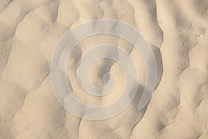 Closeup of sand pattern of a beach