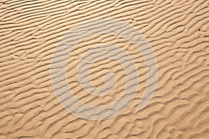 Closeup of sand pattern of a beach