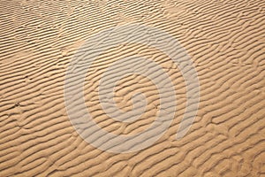 Closeup of sand pattern of a beach