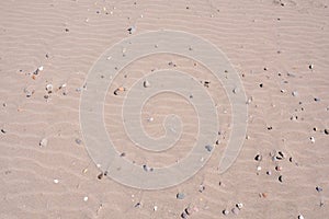 closeup sand pattern of a beach in the summer