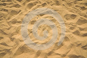 Closeup of sand pattern of a beach in the summer