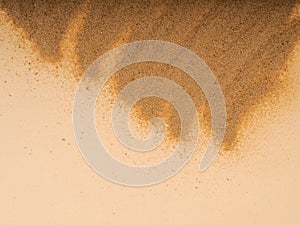 Closeup of sand pattern of a beach in the summer