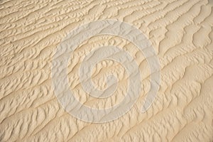 Closeup of sand pattern of beach in summer