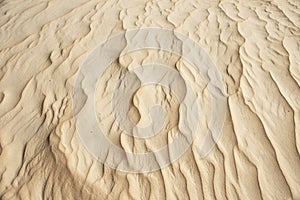 Closeup of sand pattern of beach in summer