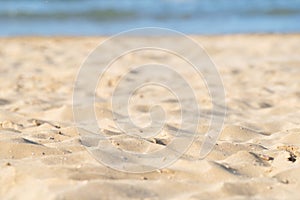 Closeup of sand pattern of beach in the summer.