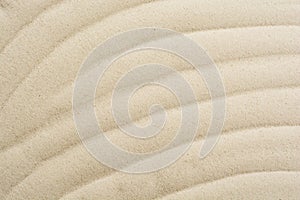 Closeup of sand pattern on a beach in the summer