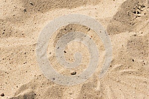 Closeup of sand pattern of a beach in the summer