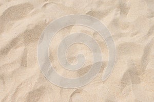 Closeup of sand pattern of a beach in the summer