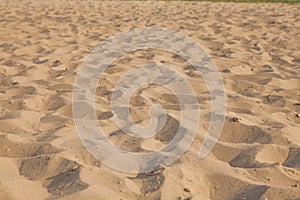 Closeup of sand pattern of a beach in the summer. Background.concept for summer season