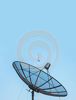 Closeup satellite dish on beautiful clear blue sky textured background with copy space
