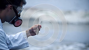 Closeup of scientist dissatisfied with water quality, environmental problems photo
