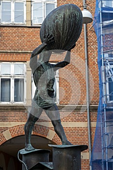 Closeup of the sculpture `Man with the egg` in Haderslev, Denmark on June 9th 2020